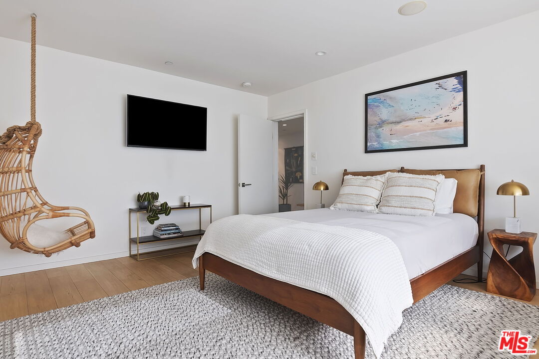 1220 Cabrillo Avenue Venice, CA 90291 - Photo 14 of 26 a bedroom with a bed and tv
