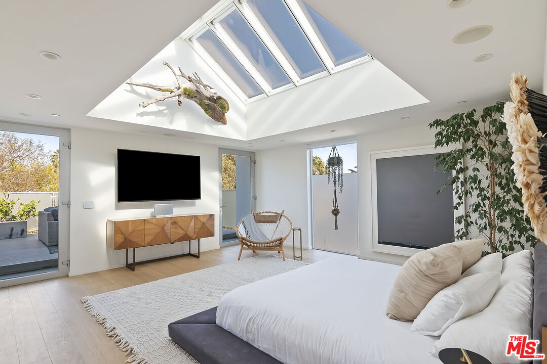 1220 Cabrillo Avenue Venice, CA 90291 - Photo 17 of 26 a bedroom with bed and flat screen tv