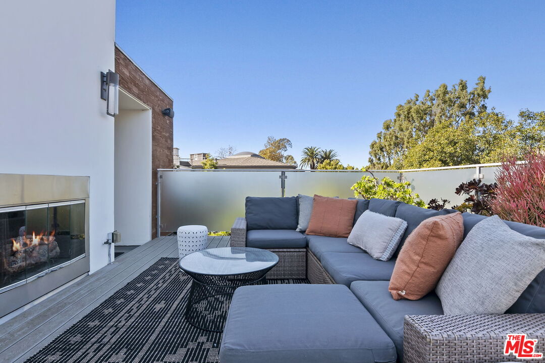 1220 Cabrillo Avenue Venice, CA 90291 - Photo 18 of 26 a outdoor living room with furniture and a fireplace