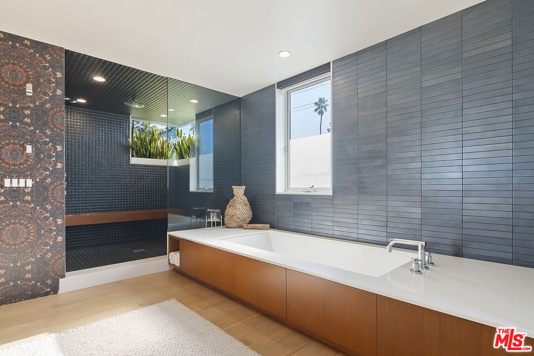 1220 Cabrillo Avenue Venice, CA 90291 - Photo 19 of 26 a bathroom with a tub sink and mirror
