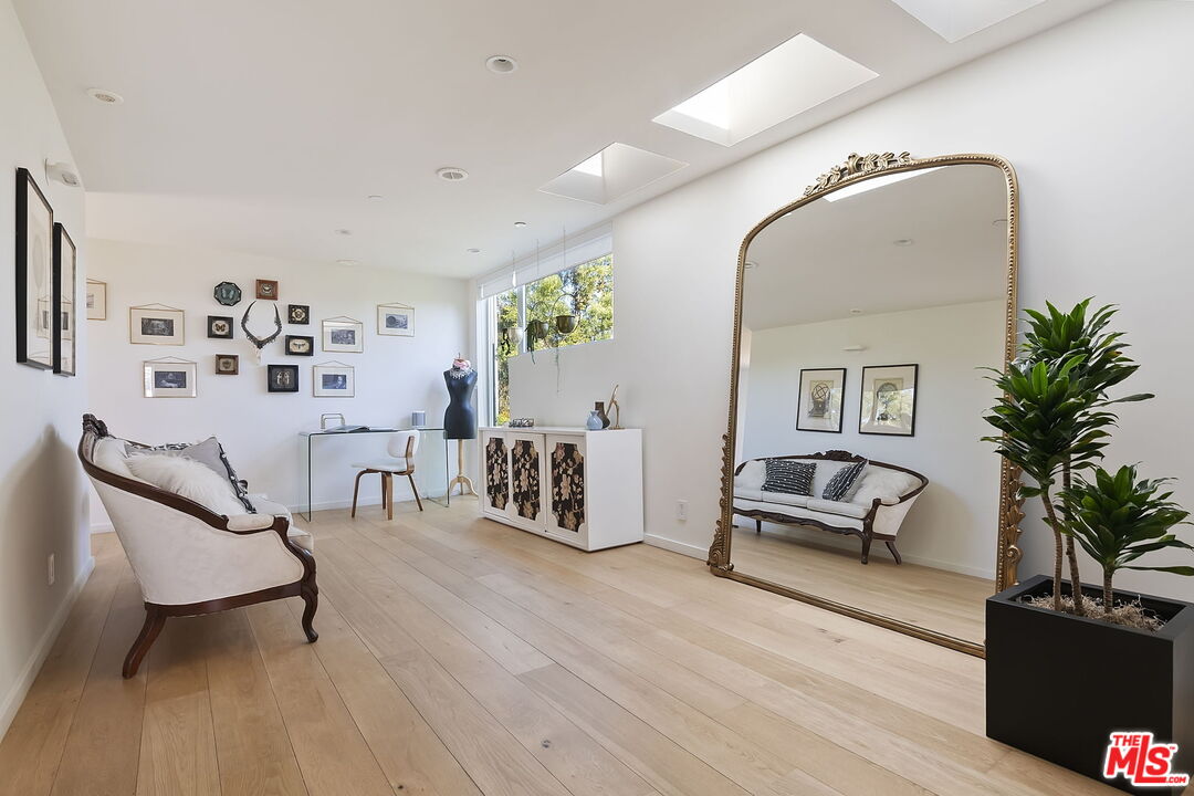 1220 Cabrillo Avenue Venice, CA 90291 - Photo 22 of 26 a living room with furniture and wooden floor
