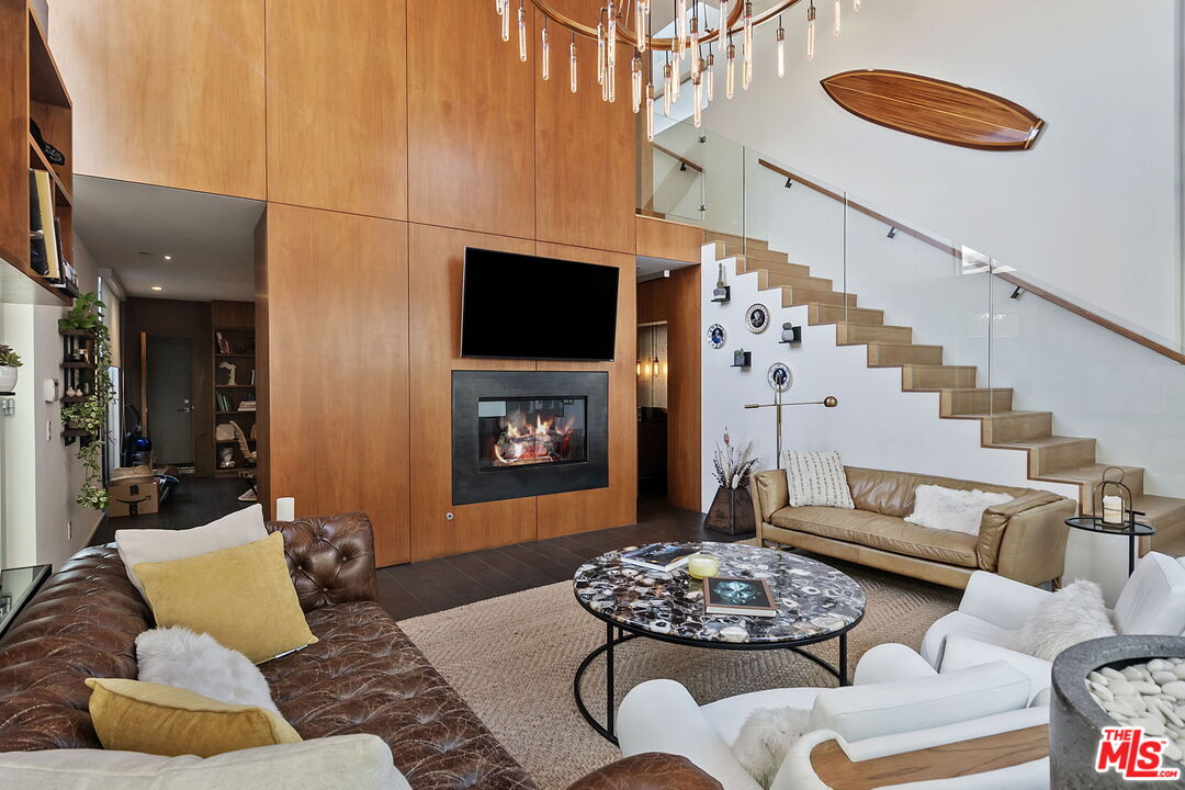 1220 Cabrillo Avenue Venice, CA 90291 - Photo 5 of 26 a living room with furniture and a fireplace