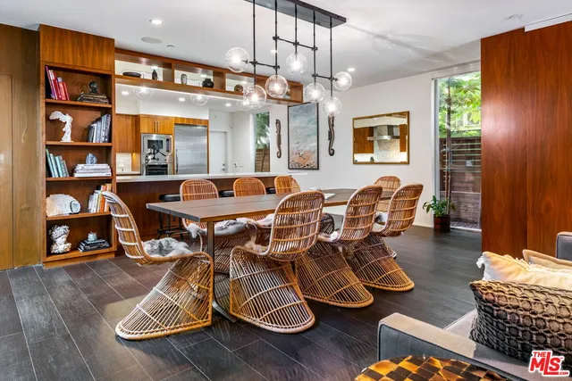 a view of a dining room with furniture wooden floor and chandelier