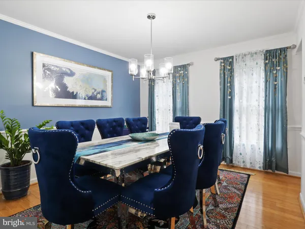 a view of a dining room with furniture and window