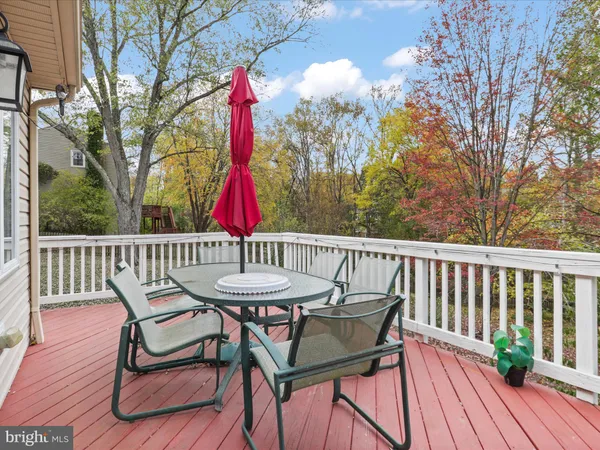 a view of a table and chairs on the roof deck