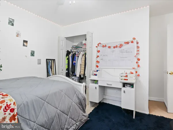 a bedroom with a bed and a closet