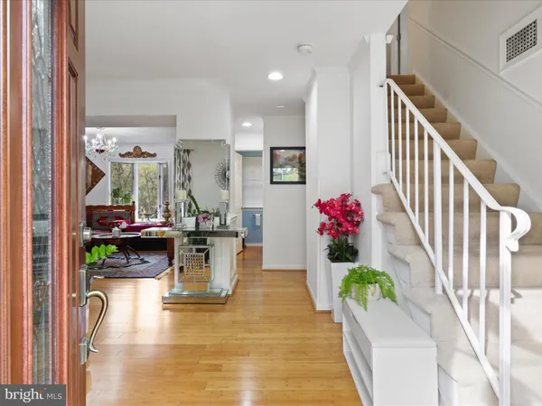 a view of living room with furniture and wooden floor