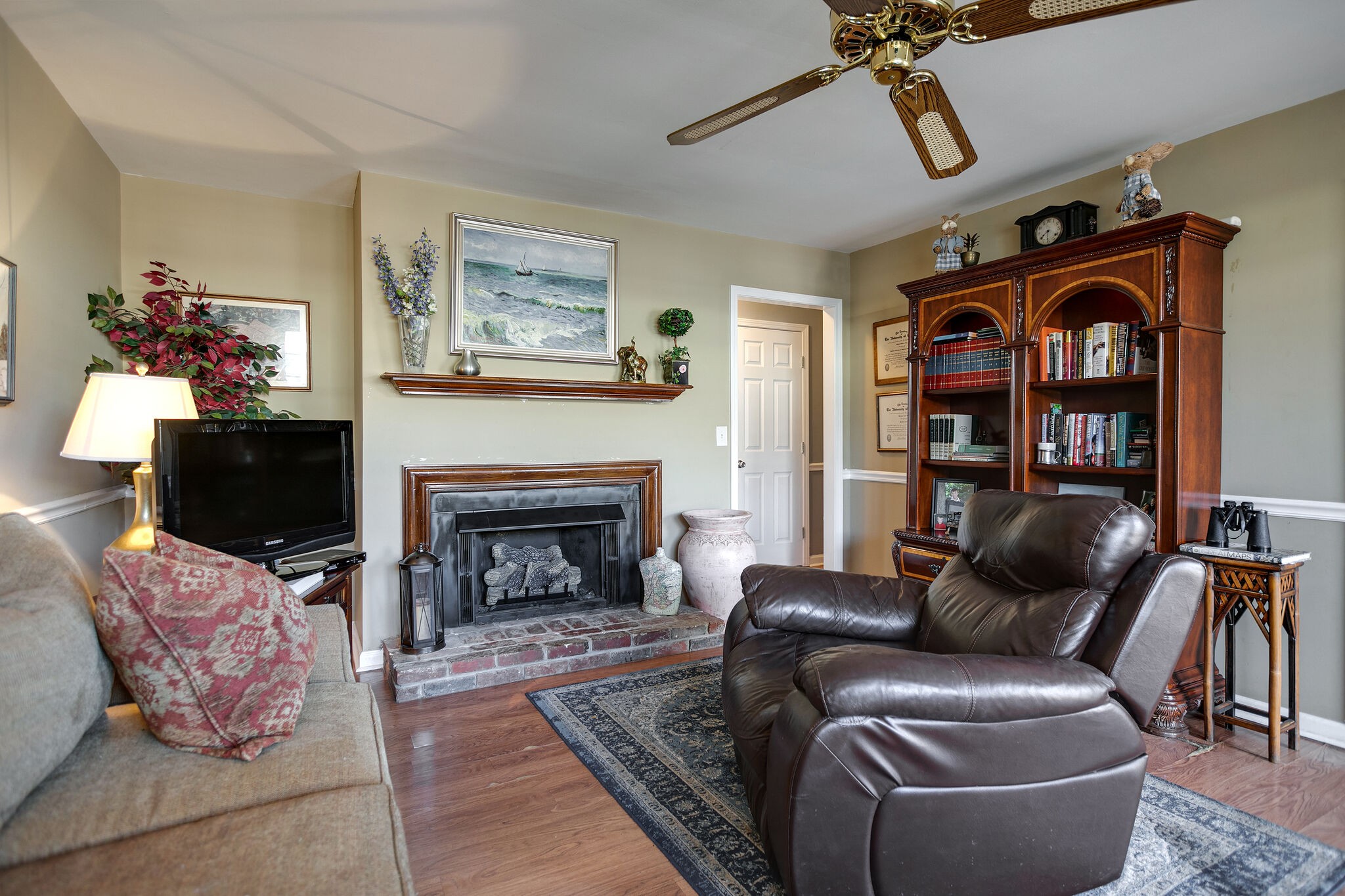 1011 General George Patton Road Nashville, TN 37221 - Photo 14 of 30 a living room with furniture a flat screen tv and a fireplace