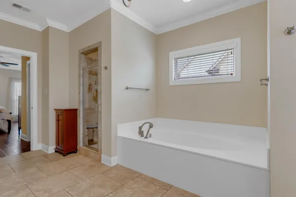 a spacious bathroom with a bathtub and a shower
