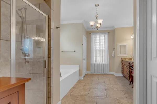 a very nice looking bathroom with a bathtub and shower