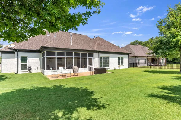 a front view of a house with a garden and porch