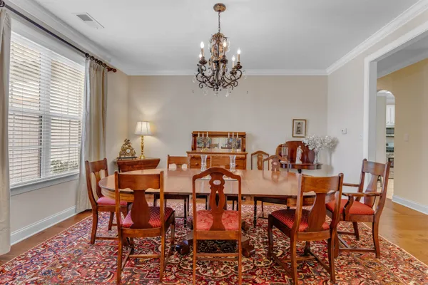 a view of a dining room with furniture and window