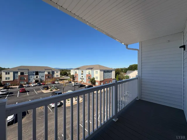 a view of hallway with wooden floor