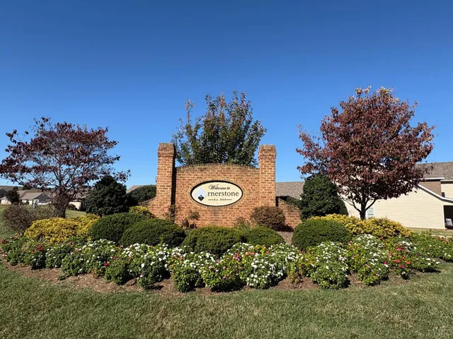 a view of a wooden door with a sign on the wall