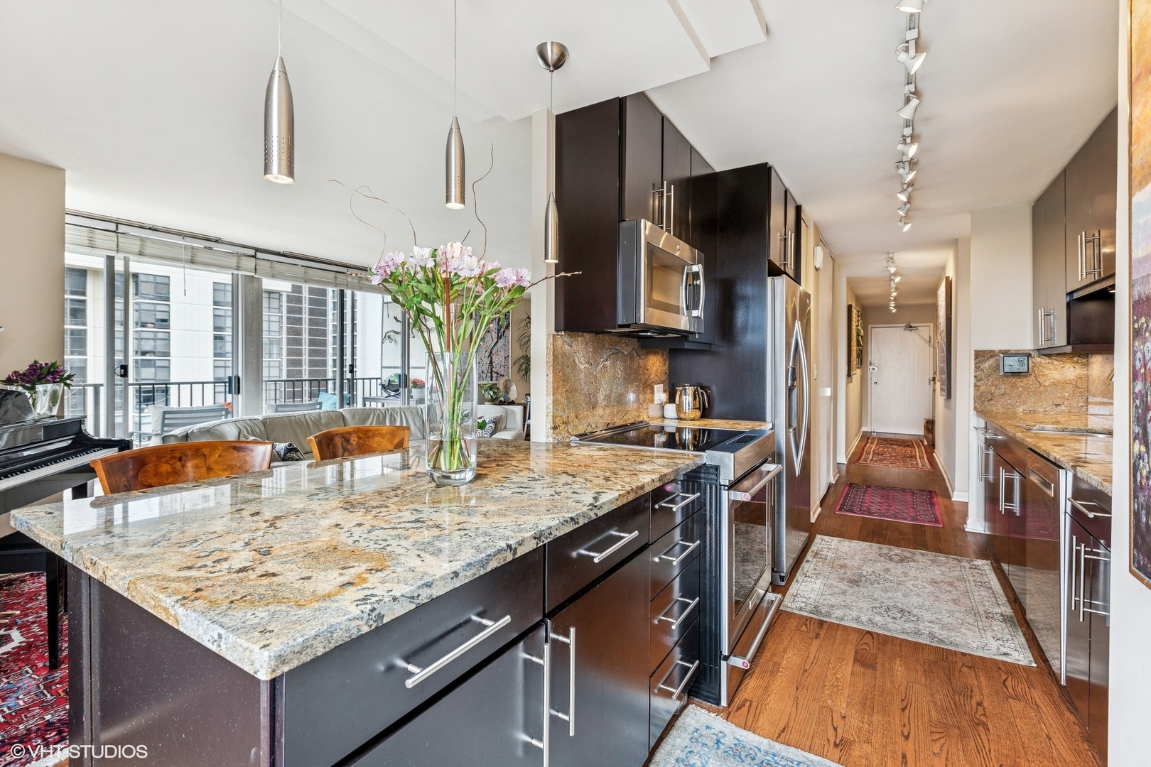 71 East Division Street, Unit 1606 Chicago, IL 60611 - Photo 14 of 34 a kitchen with sink stove and refrigerator
