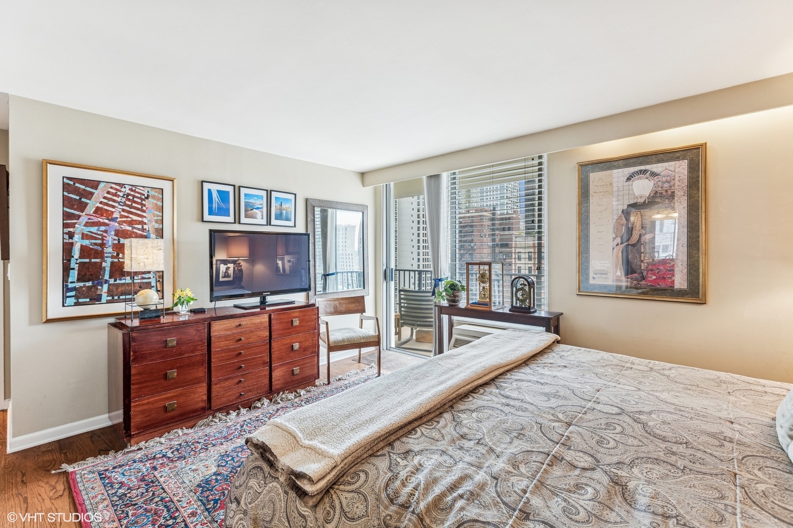 71 East Division Street, Unit 1606 Chicago, IL 60611 - Photo 16 of 34 a bedroom with furniture and a flat screen tv
