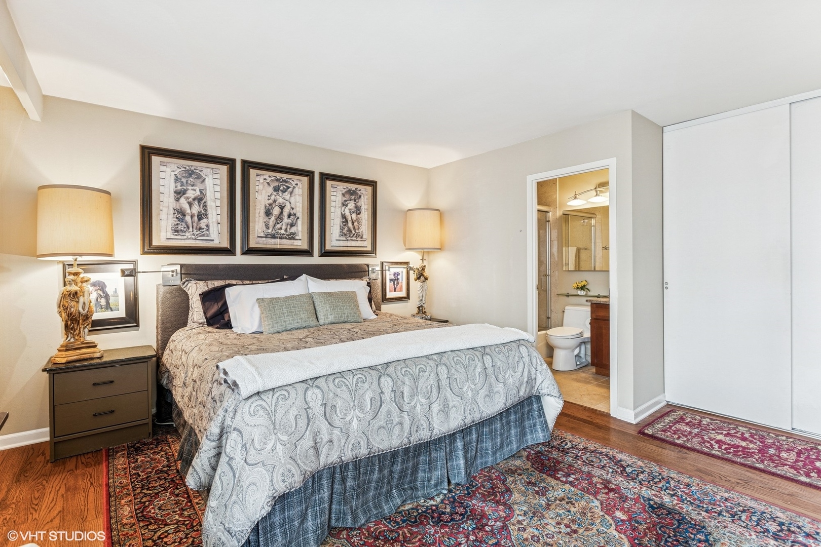 71 East Division Street, Unit 1606 Chicago, IL 60611 - Photo 17 of 34 a bedroom with a bed a mirror on dresser and a window