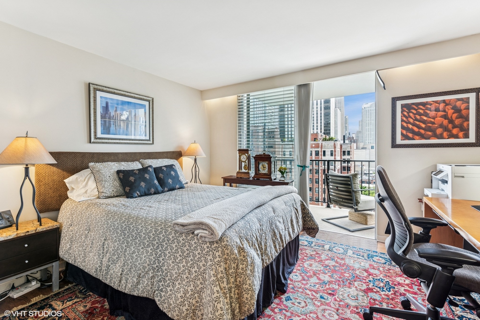 71 East Division Street, Unit 1606 Chicago, IL 60611 - Photo 19 of 34 a bedroom with a bed and wooden floor