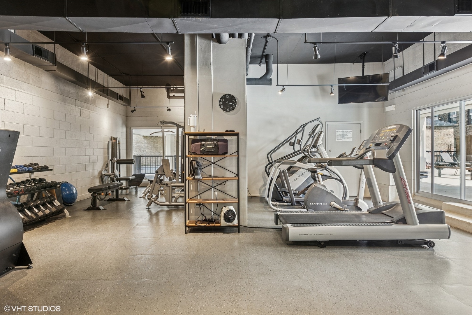 71 East Division Street, Unit 1606 Chicago, IL 60611 - Photo 28 of 34 a view of a room with gym equipment