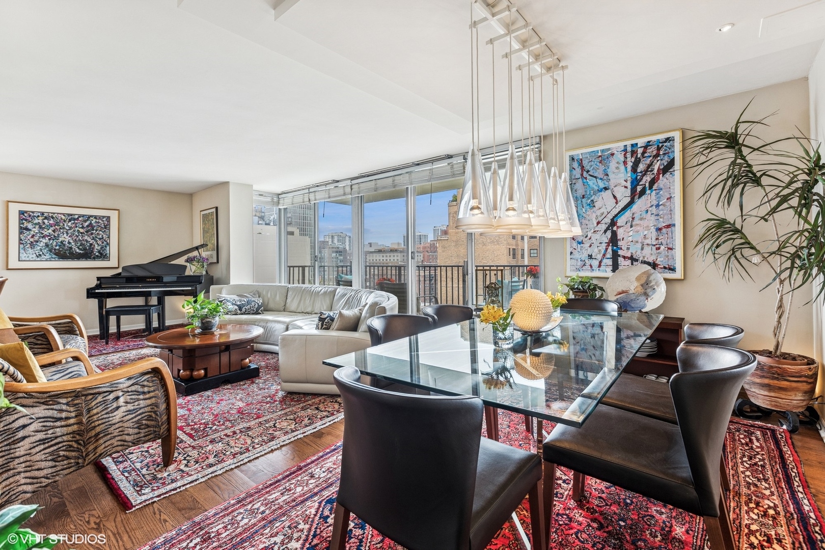 71 East Division Street, Unit 1606 Chicago, IL 60611 - Photo 3 of 34 a living room with furniture a chandelier and a rug