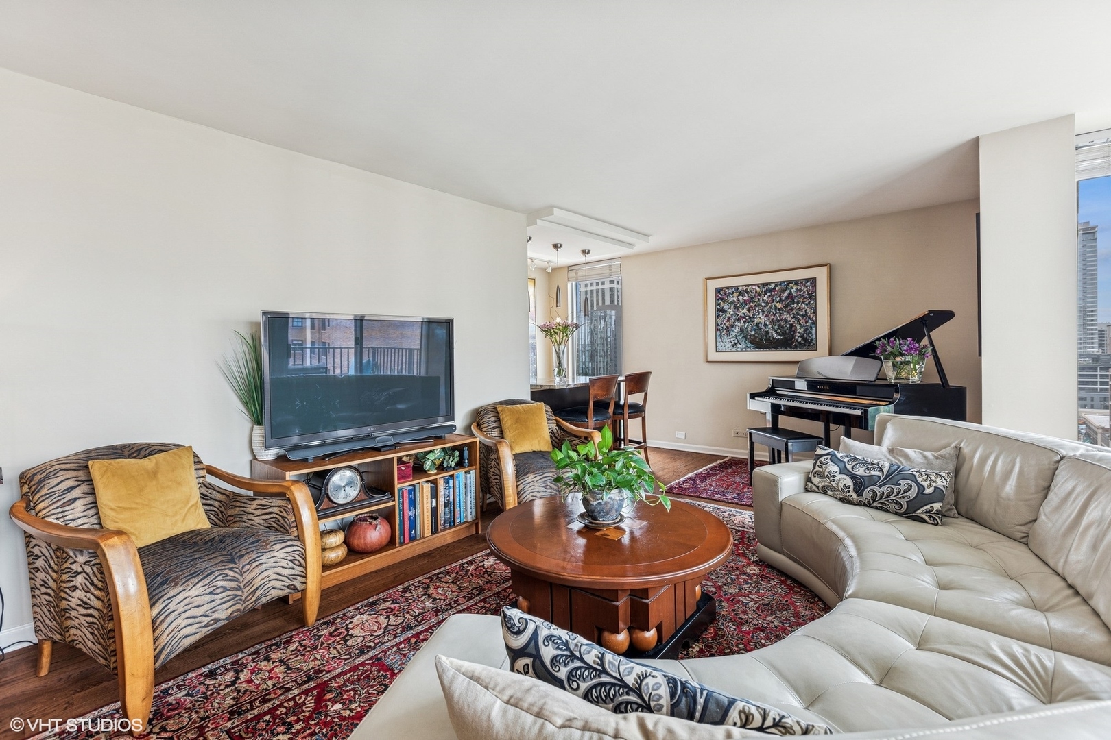 71 East Division Street, Unit 1606 Chicago, IL 60611 - Photo 6 of 34 a living room with furniture and a dining table