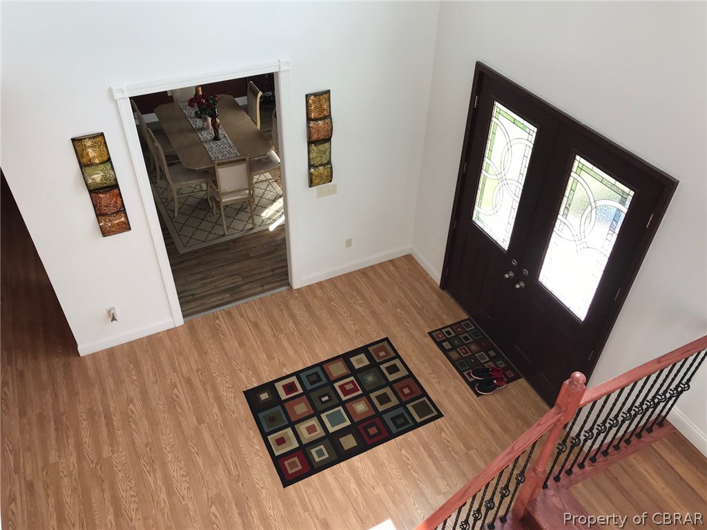 3939 Funny Farm Road Hayes, VA 23072 - Photo 3 of 17 View from upstairs to foyer with DR off the foyer to the left side in picture