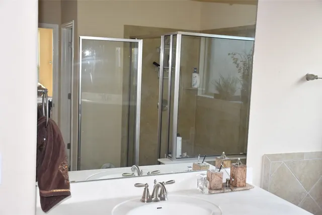 a bathroom with a sink and a mirror