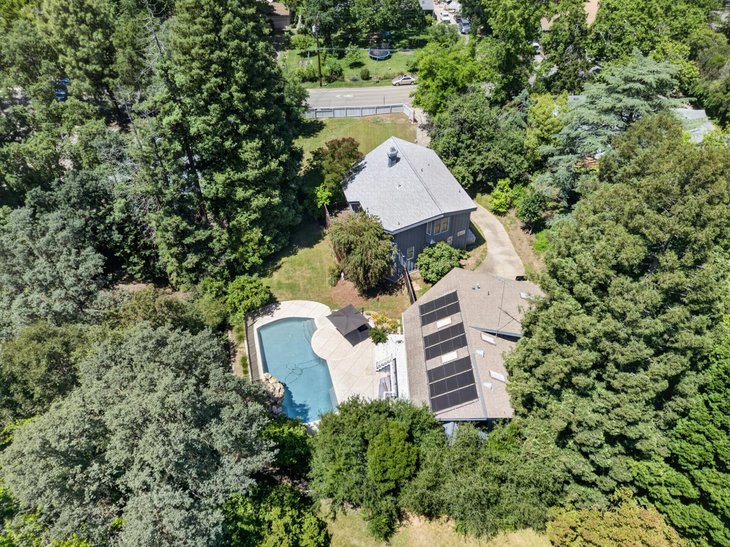 3940 Bannister Road Fair Oaks, CA 95628 - Photo 72 of 84 a aerial view of a house with a yard and large trees