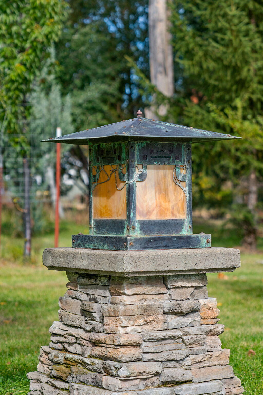 21925 Bear Creek Road Bend, OR 97702 - Photo 66 of 104 Hand made stained glass and copper pedestal lamps line the driveway