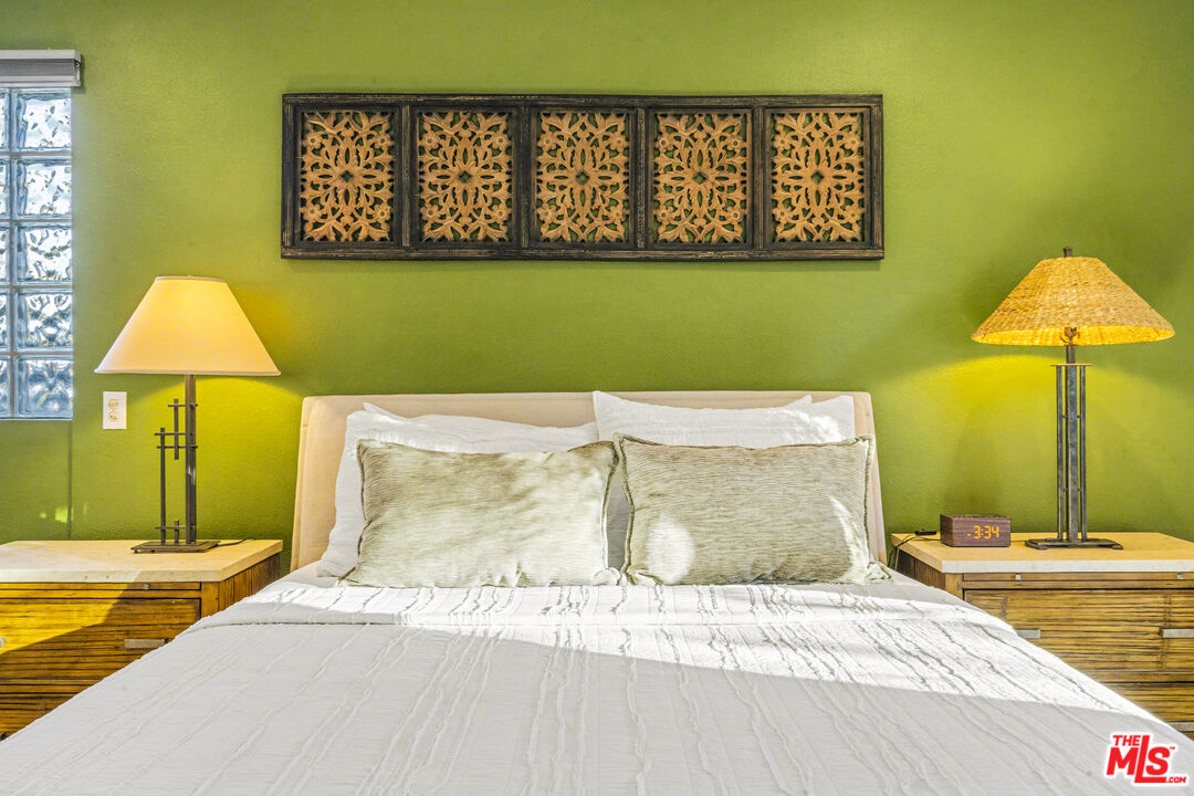 37223 Ferber Drive Rancho Mirage, CA 92270 - Photo 21 of 48 a bedroom with a bed and a table