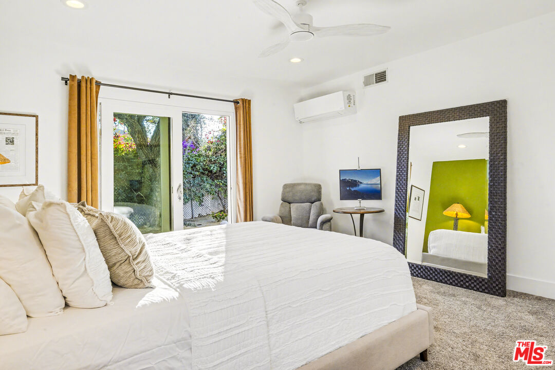 37223 Ferber Drive Rancho Mirage, CA 92270 - Photo 22 of 48 a bedroom with a bed and a dresser next to a window