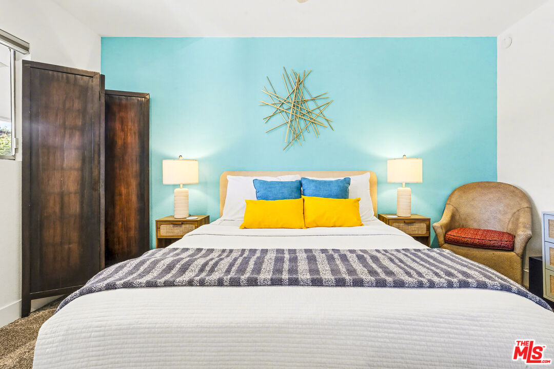 37223 Ferber Drive Rancho Mirage, CA 92270 - Photo 26 of 48 a bedroom with a bed and a painting on the wall