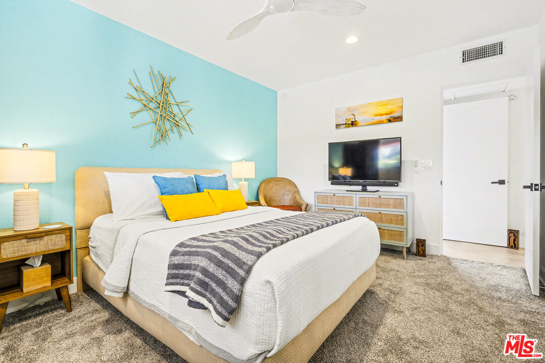 37223 Ferber Drive Rancho Mirage, CA 92270 - Photo 27 of 48 a bedroom with a bed and a flat screen tv