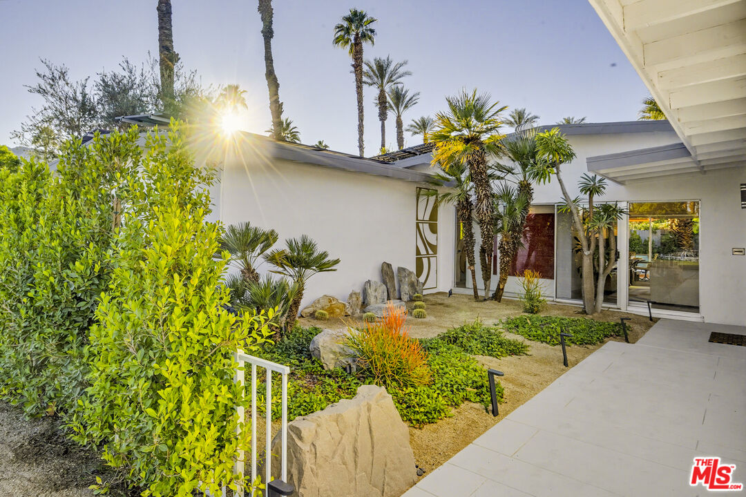 37223 Ferber Drive Rancho Mirage, CA 92270 - Photo 4 of 48 a vase of flowers sitting on a table with chairs