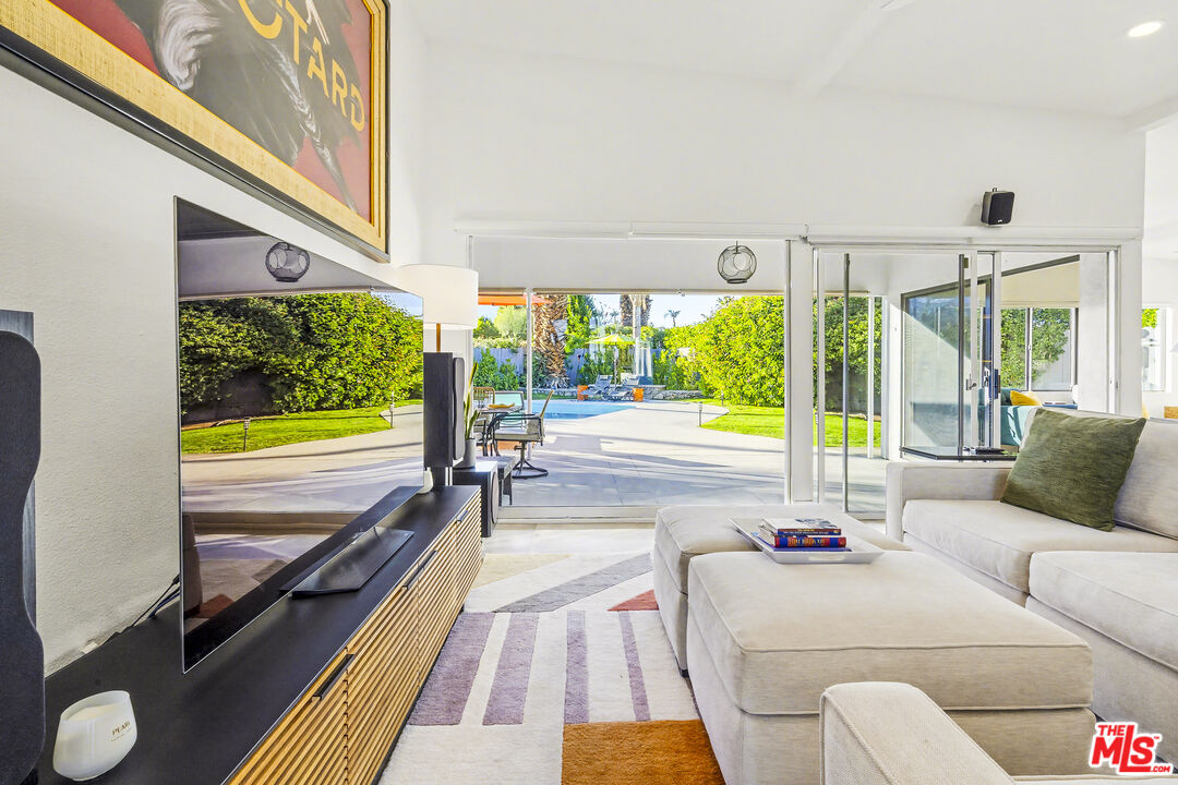 37223 Ferber Drive Rancho Mirage, CA 92270 - Photo 8 of 48 a living room with furniture tv and large windows