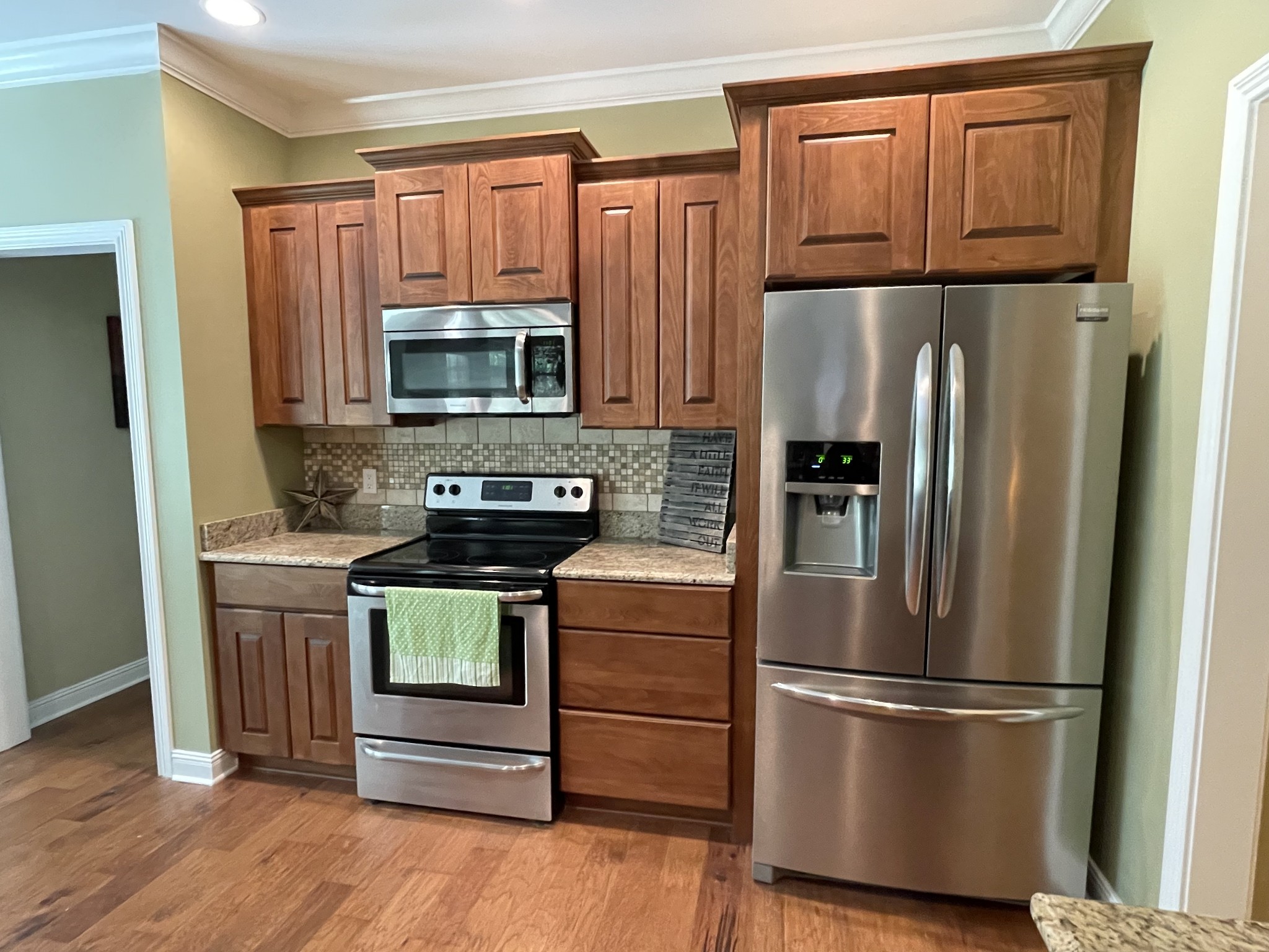 470 Clarks Store Sinking Fork Road Cerulean, KY 42215 - Photo 11 of 42 a kitchen with appliances a refrigerator and a stove top oven