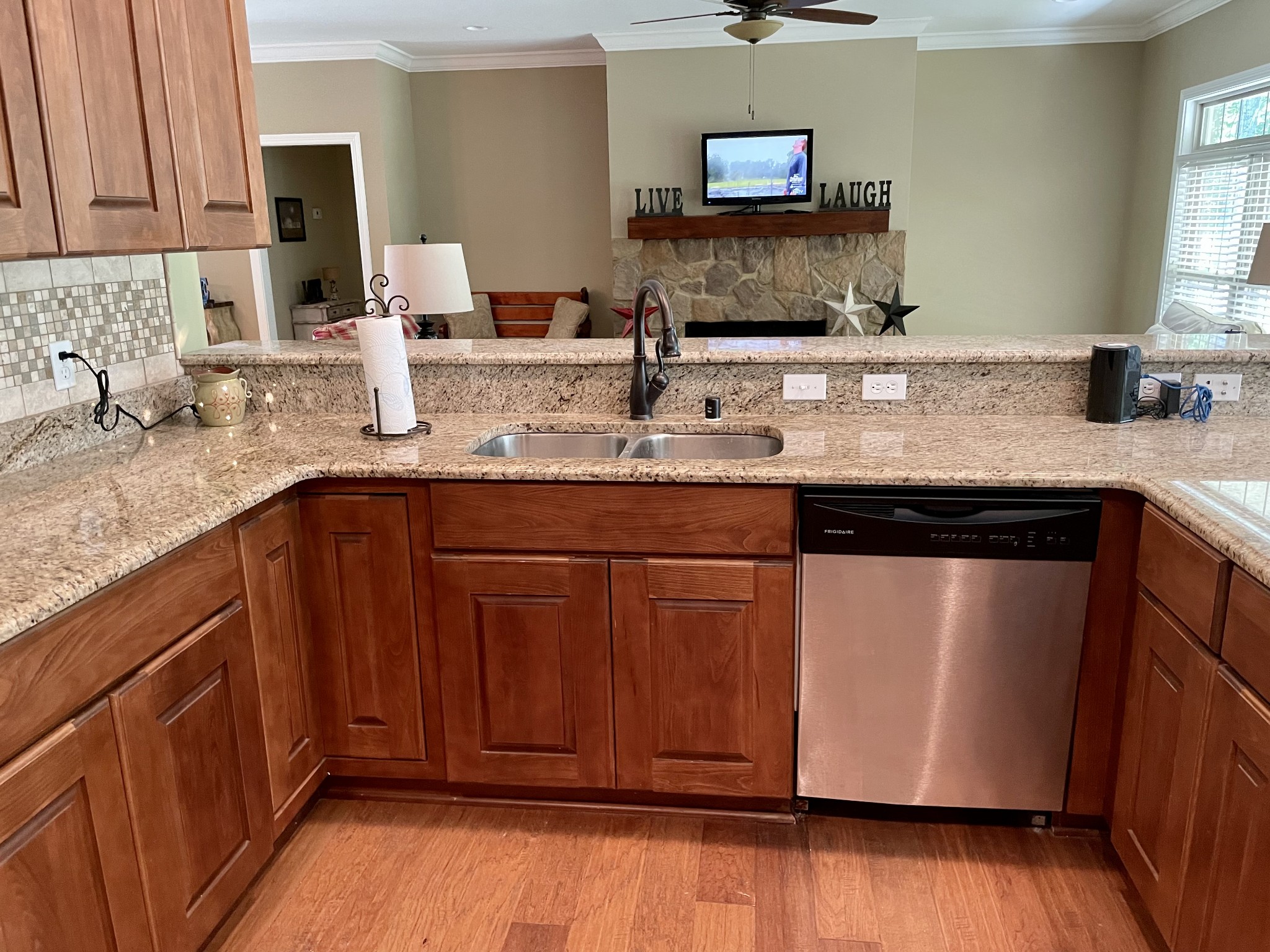 470 Clarks Store Sinking Fork Road Cerulean, KY 42215 - Photo 12 of 42 a kitchen with stainless steel appliances granite countertop wooden cabinets a sink and dishwasher with wooden floor