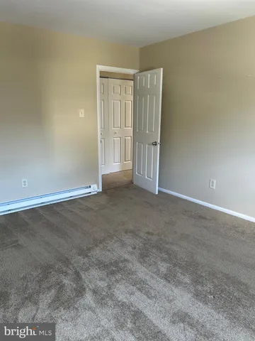 an empty room with a empty space and window