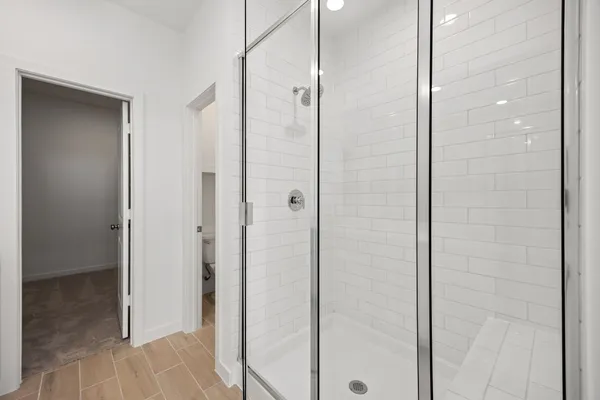 a bedroom with a bed and a mirror