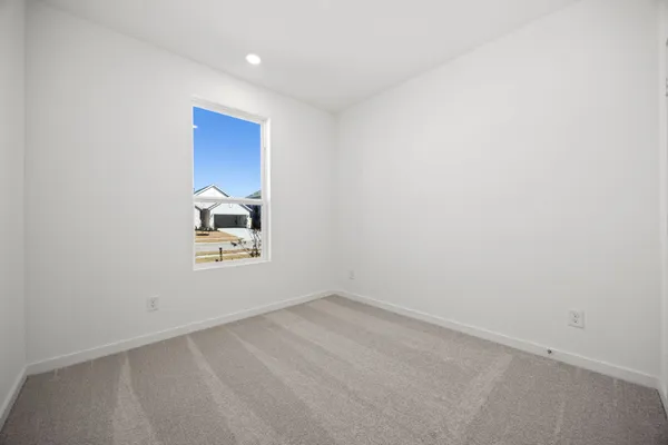 a bathroom with a shower and a glass door