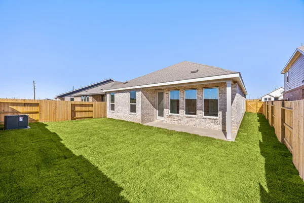 a view of house with backyard of the house