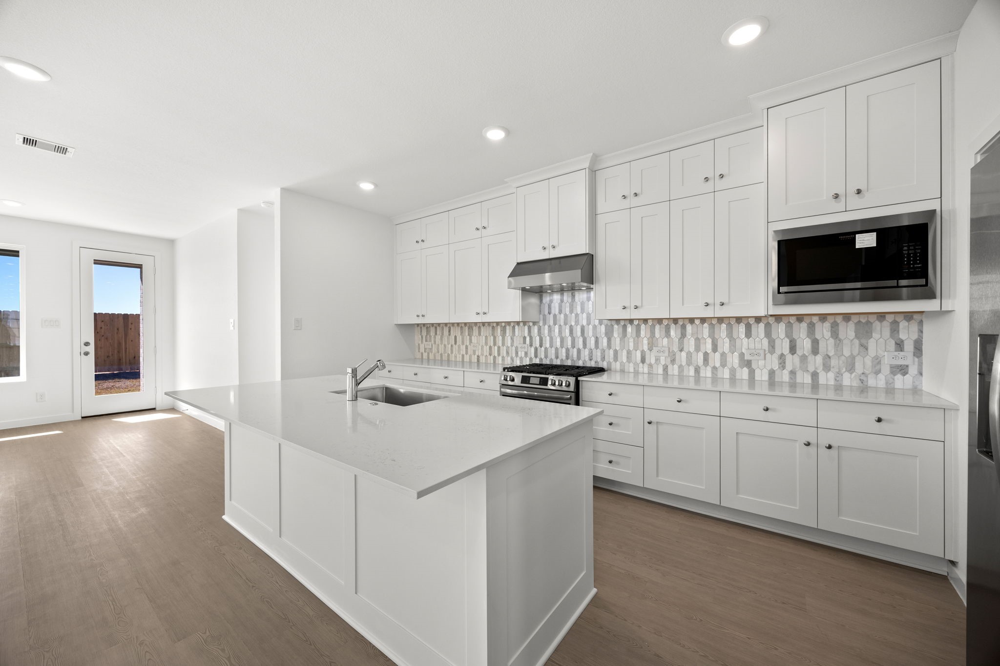 28947 Rustic Robin Lane Hockley, TX 77447 - Photo 5 of 33 The kitchen island will serve as your breakfast bar and comfortably seats 3.