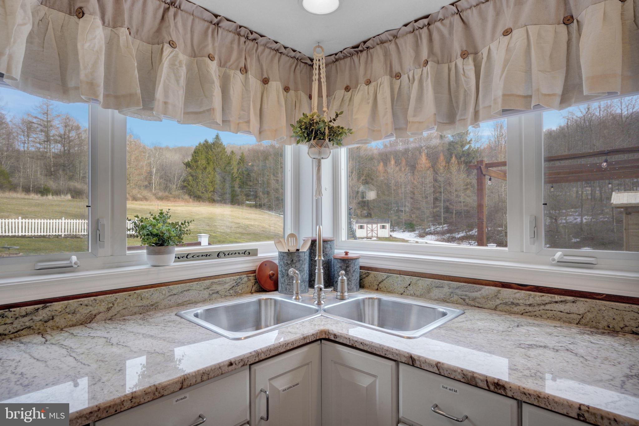 259 A A-Frame Road Coudersport, PA 16915 - Photo 19 of 130 Sunlit kitchen with scenic views.