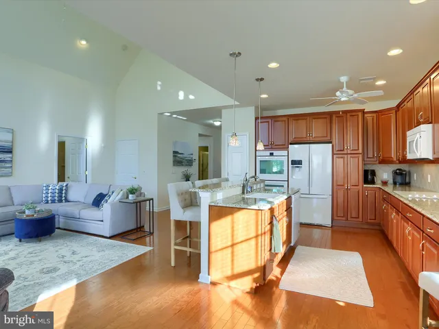 a large kitchen with stainless steel appliances lots of counter space and breakfast area