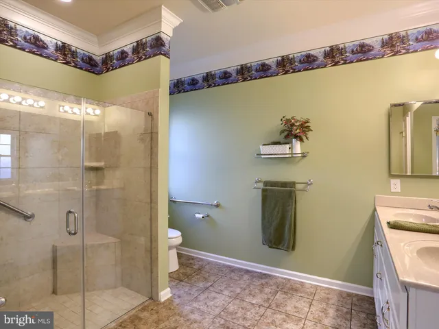 a bathroom with a shower and a sink