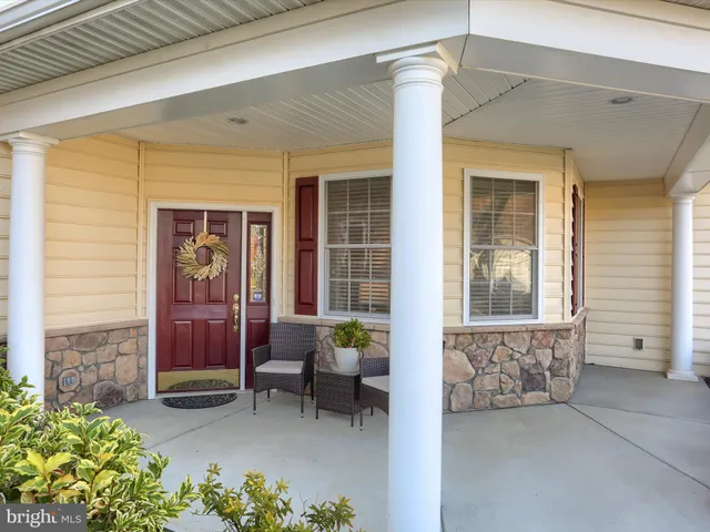 a view of a house with outdoor seating