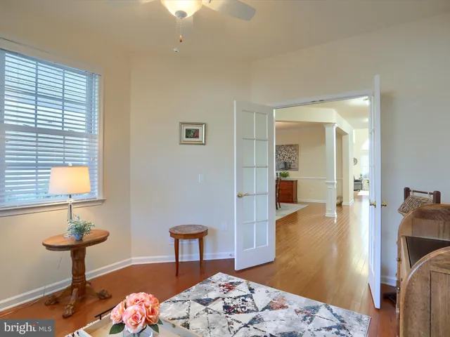 a bedroom with furniture and a wooden floor