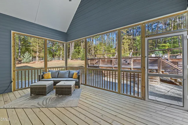 a living room with large windows