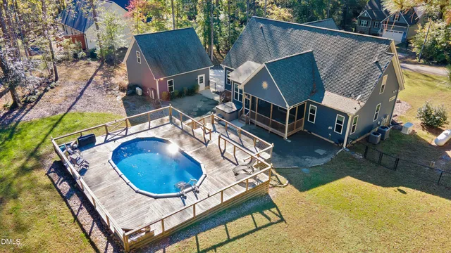 an aerial view of a house roof deck and outdoor seating