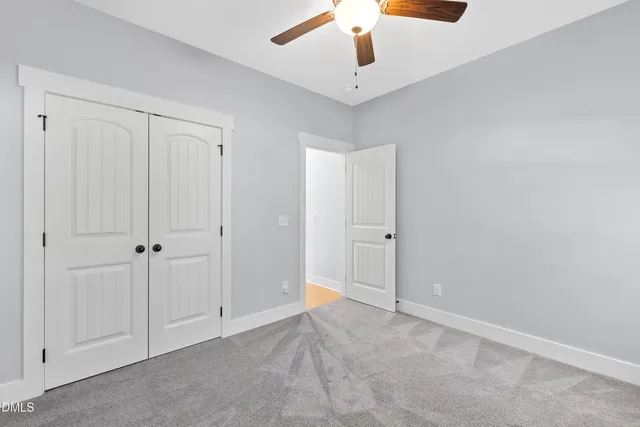 an empty room with fan